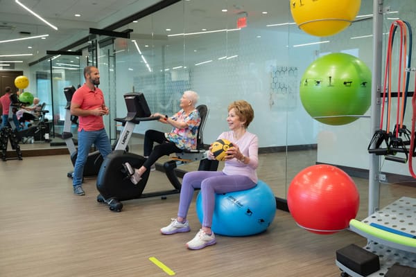 Residents engaging in an exercise activity in a gym
