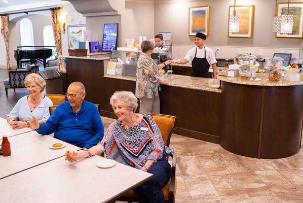 Residents enjoying refreshments in the dining area