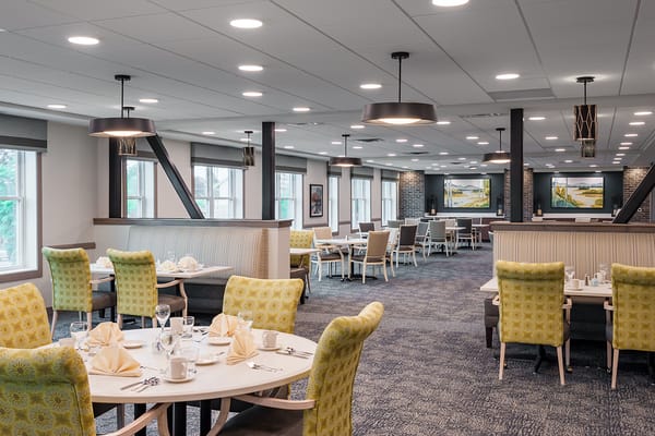 Dining area with bright decor and table settings