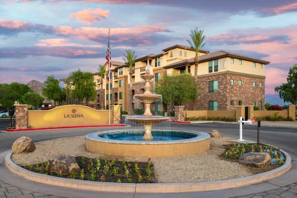 Exterior view of La Siena with fountain and landscaping