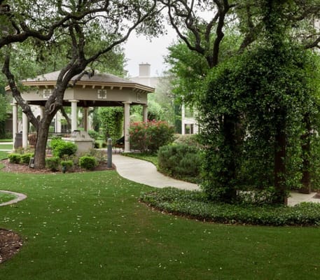 Well-maintained garden with gazebo and pathway