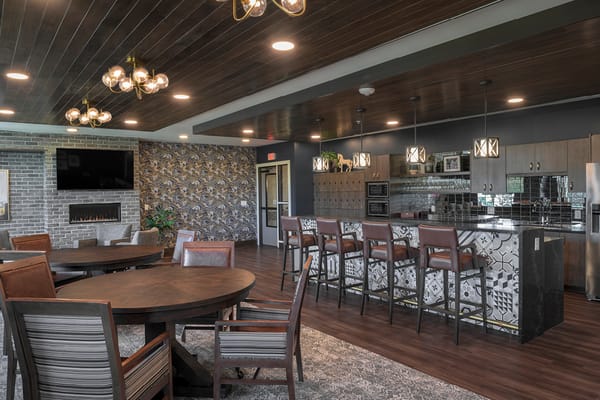 Bright common area with seating and kitchen