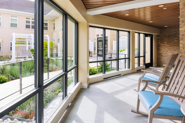 Bright sunroom with seating and garden views