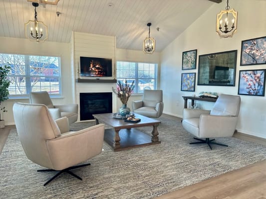 Cozy common area with a fireplace and seating