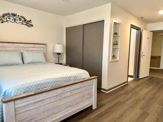 Bright resident room with a bed and decor