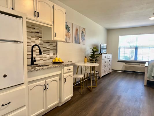 Bright interior of a resident unit with kitchenette
