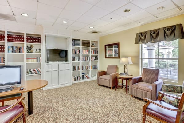 Cozy common area with bookshelves and seating