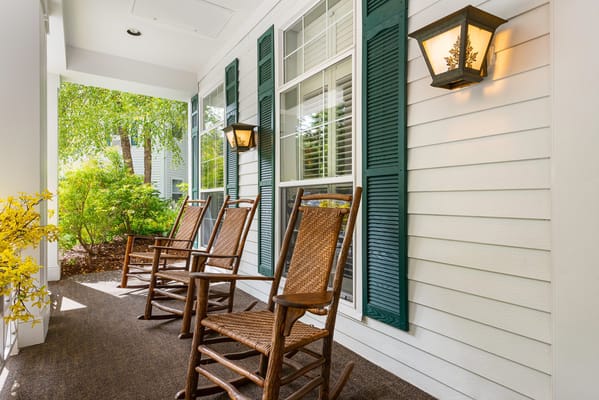 Rocking chairs on a porch in a garden