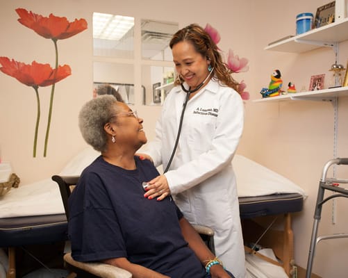 Doctor interacting with a senior resident in an office