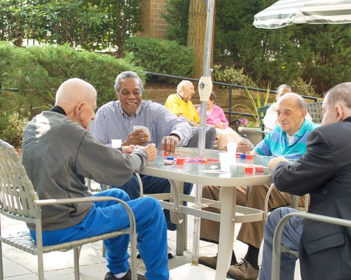 Residents enjoying a game outdoors at the facility