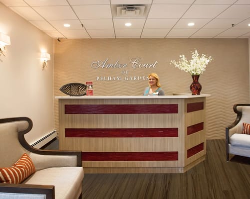 Reception area with staff member at the front desk