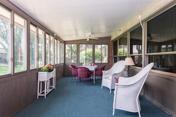 Bright sunroom with seating and plants