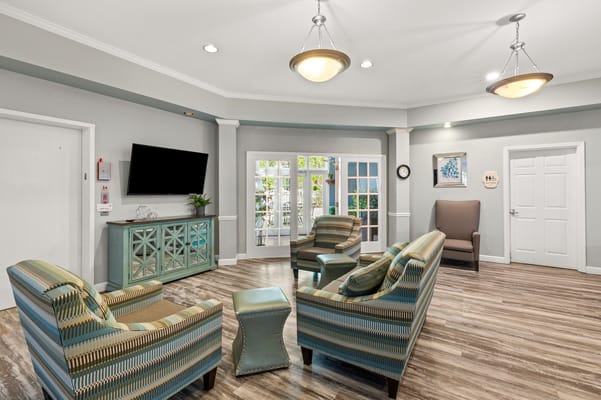 Bright common area with seating and natural light