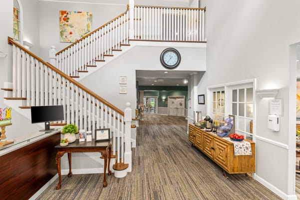 Bright interior lobby with stairs and decor