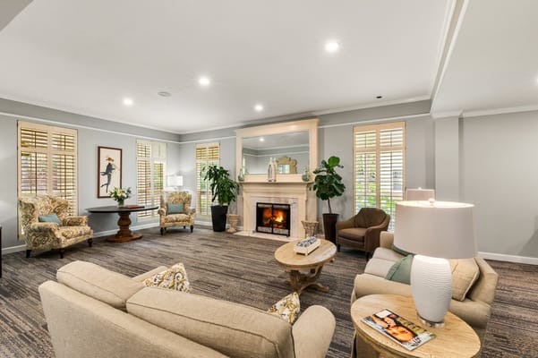 Interior common area with seating and a fireplace