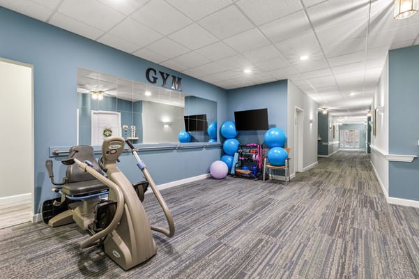 Interior view of a gym area with exercise equipment