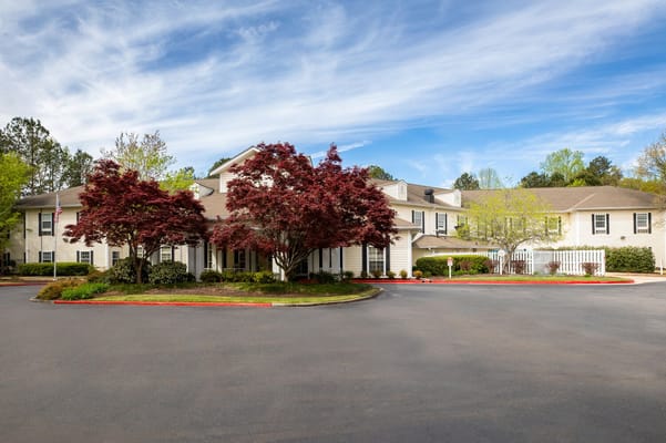 Exterior view of Arbor Terrace, featuring landscaped entrance