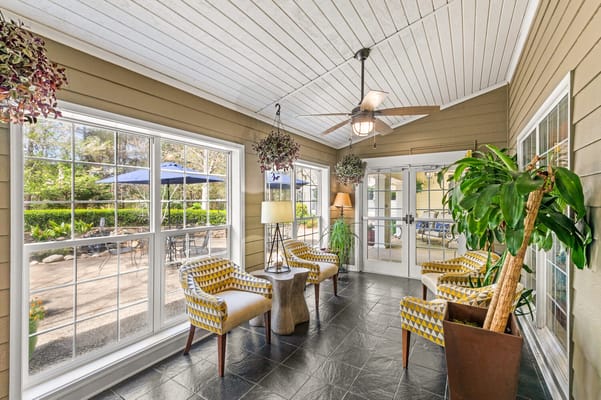 Bright common area with seating and outdoor views
