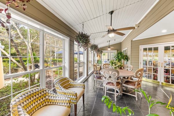 Bright communal area with seating and large windows