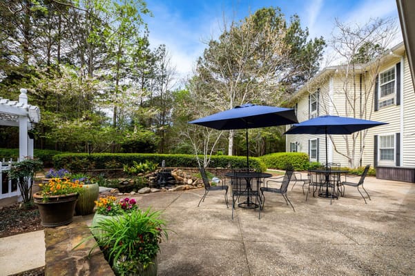 Outdoor patio area with seating and umbrellas