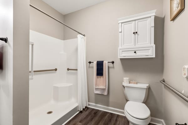 Accessible bathroom with modern fixtures and grab bars