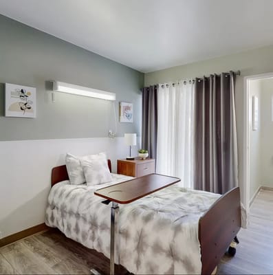 Cozy resident room with bed and natural light