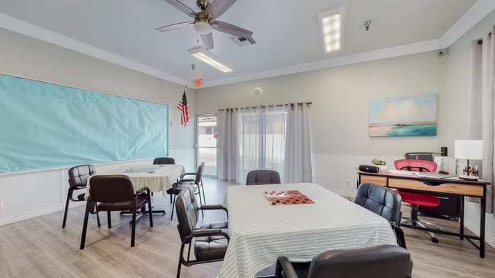 Bright common area with tables and chairs