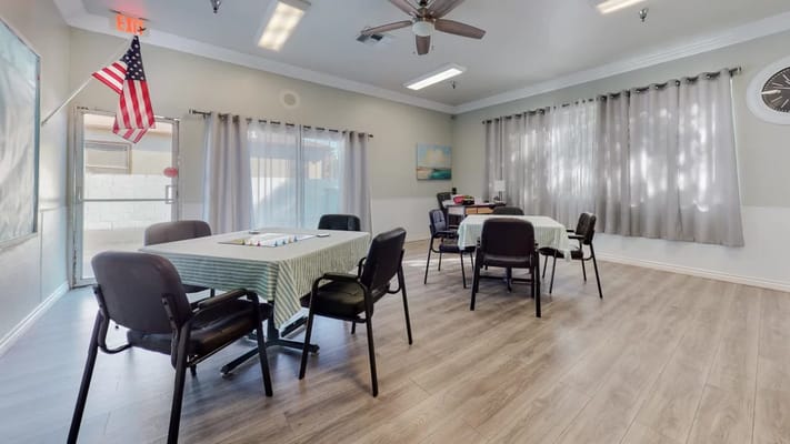 Bright common area with tables and chairs
