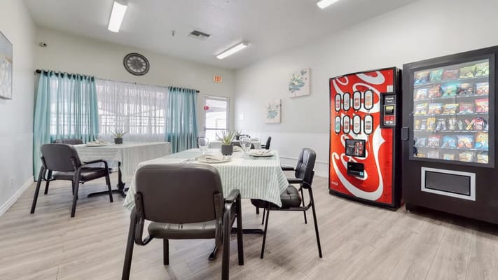 Dining room with tables and vending machine