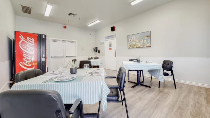 Dining room setup with tables and chairs