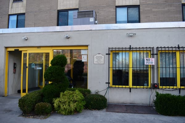 Exterior view of Oceanview Manor with entry and landscaping