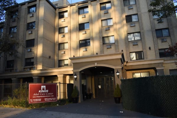 Front entrance of Kings Adult Care Center with signage