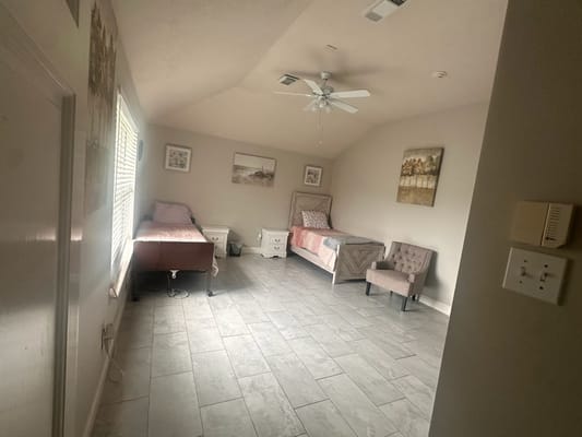 A well-furnished resident room with two beds