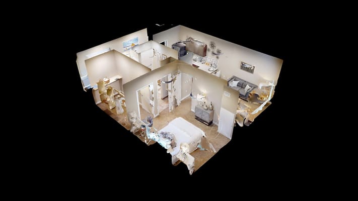 Interior view of a cozy apartment with living room, kitchen, and bedroom areas.