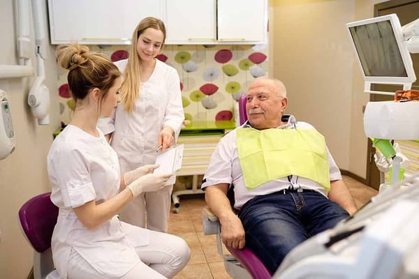 Dental care scene with a senior resident and staff