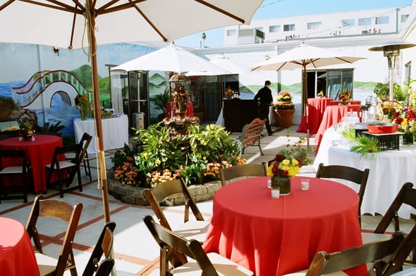 Outdoor event setup with tables and umbrellas