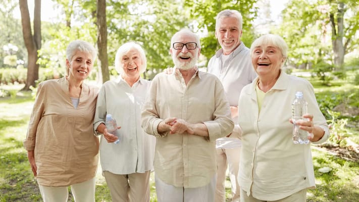 Group of smiling seniors enjoying time outdoors