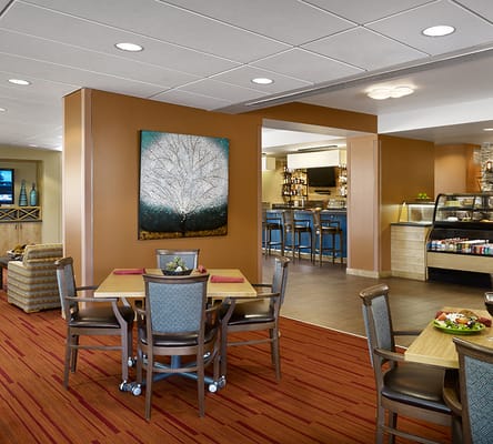 Bright dining room with tables and food service area