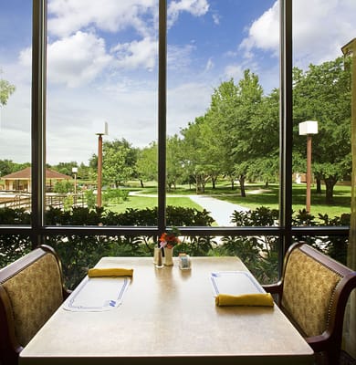 Dining area with a view of a landscaped garden