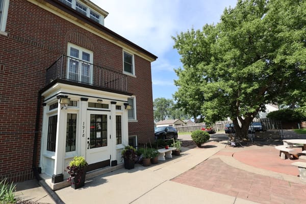 Exterior view of the facility entrance and garden