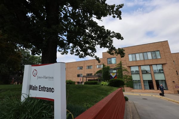 Exterior view of Jones-Harrison Senior Living with entrance sign