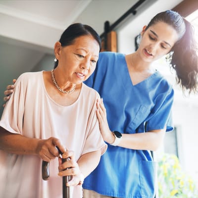 Caregiver assisting a resident indoors