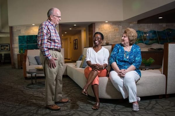 Residents chatting in a comfortable social space