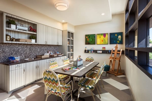 Bright activity room with colorful seating and art supplies