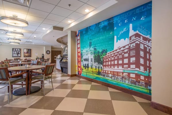 Interior of a dining room with colorful mural
