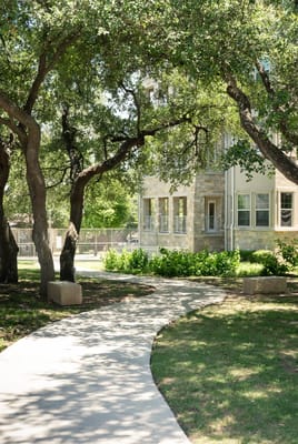 Pathway leading to the facility through trees