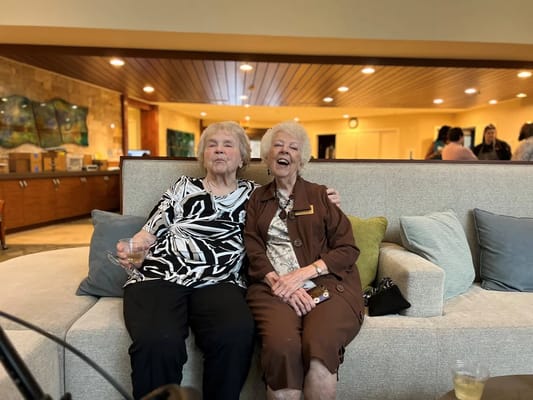 Two residents enjoying time together in a common area