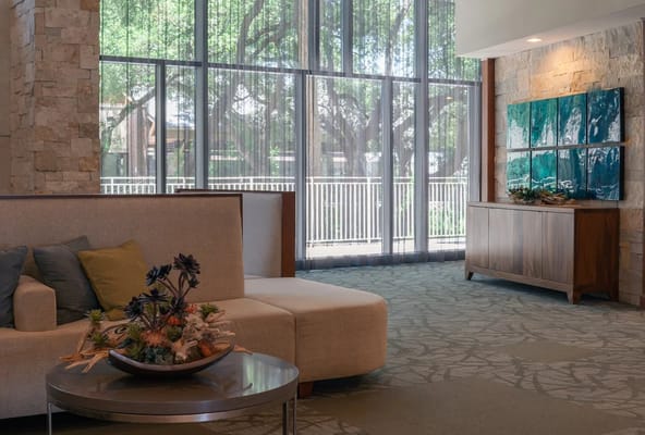 Bright interior common area with seating and artwork