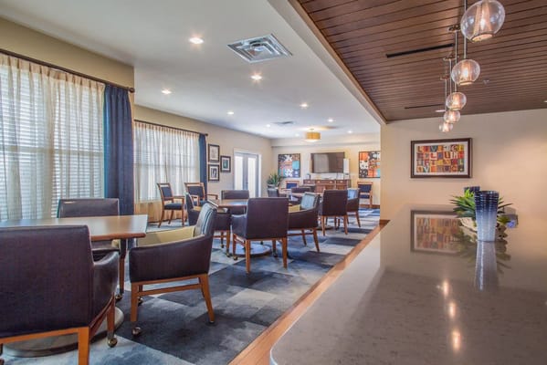 Bright common area with seating and artwork