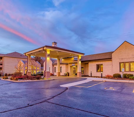 Exterior view of Harbour Village entrance at dusk